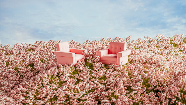 Two pink armchairs placed on a hill surrounded by blooming flowers