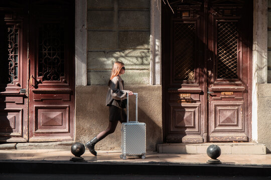 Traveller suitcase walks streets