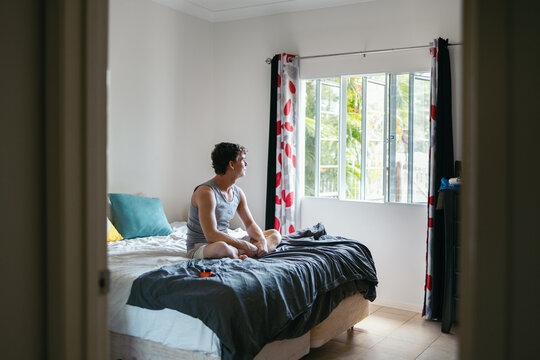Young man relaxed in his room in the morning