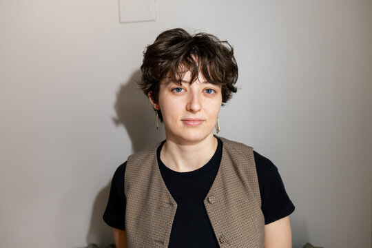 Young woman looking at camera with confident expression