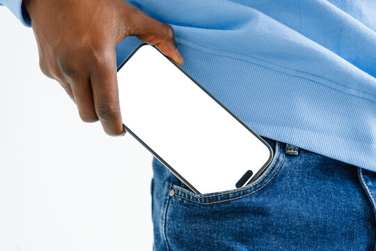 A mobile phone with white screen in man's pocket