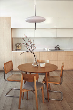 Modern kitchen interior featuring a round wooden table 