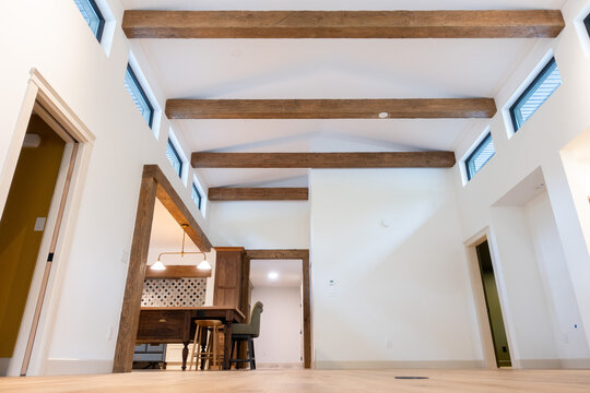 view of high wood beams in new construction home
