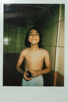 Kid smiling in the bathroom