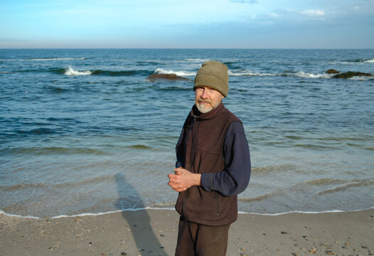 portrait of an elderly man by the sea
