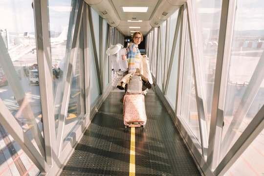 Woman boarding airplane