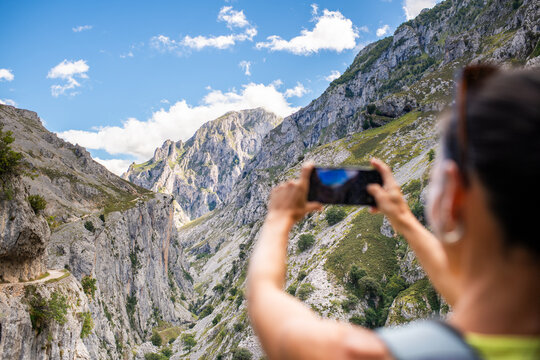 Taking pictures of impressive mountain landscape