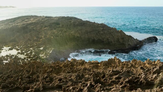Waves chrasing on the rocks on late afternoon, Jobos Beach, Isabela, Puerto Rico