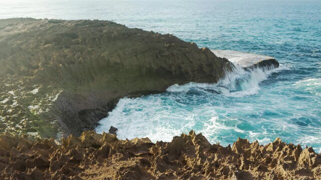 Waves chrasing on the rocks on late afternoon, Jobos Beach, Isabela, Puerto Rico