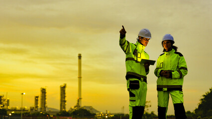 Petrochemical leaders survey their domain, a commanding industrial panorama. This strategic view at...