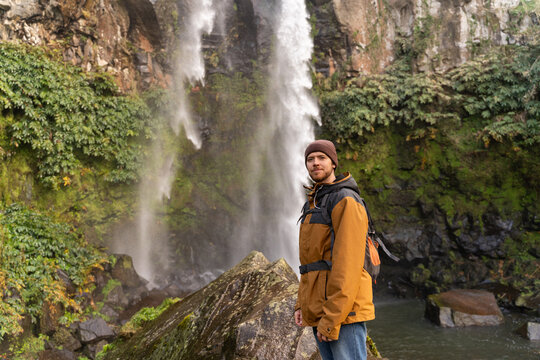 Man Exploring Waterfall Nature