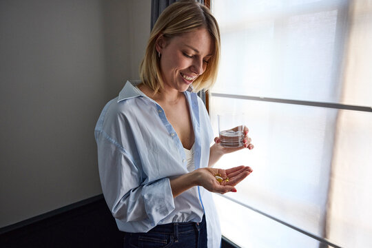 Woman taking her medication 
