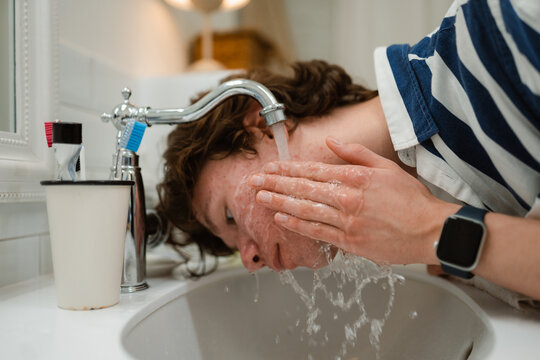A man washes his face