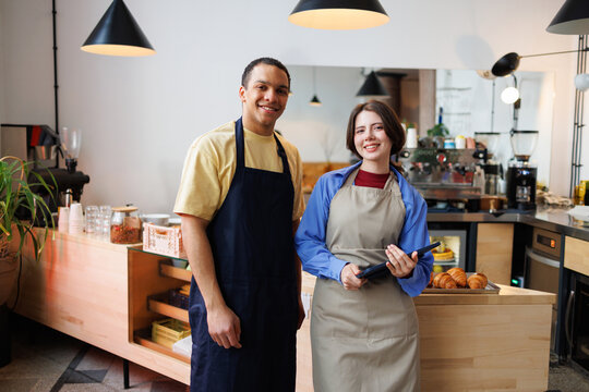 Coffee Shop Bakery Team With Tablet