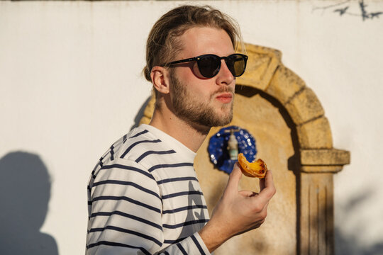 A man enjoying a pastel de nata