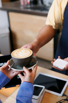 Barista Serves Fresh Coffee Cup Handed to Customer