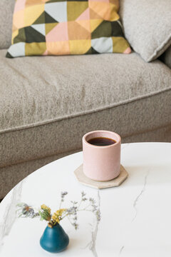 Warm Coffee Mug on Trendy Coffee Table