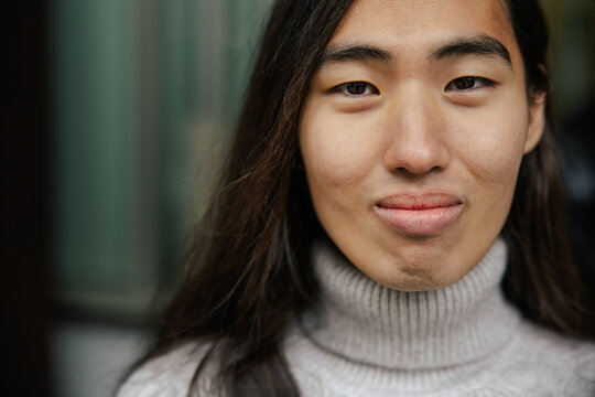 Portrait of a Long-Haired Person with a Thoughtful Expression