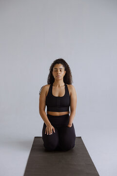 Woman Practicing Meditation in Studio Focusing on Inner Strength