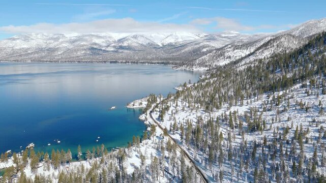 Lake Tahoe - High Aerial Flyover of Sand Harbor & East Shore after Big Snowstorm