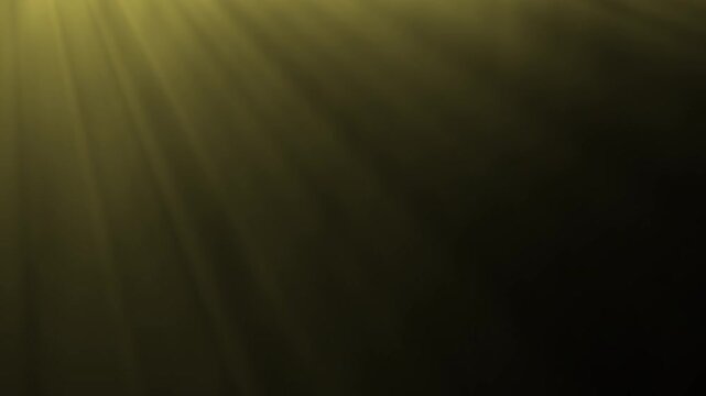 Golden light rays emanating from the top corner in darkness, creating a divine or mystical atmosphere effect