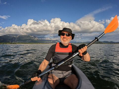 Happy rower in his kayak selfie