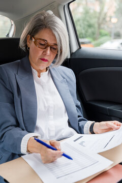 Businesswoman reviewing documents