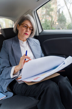 Businesswoman reviewing documents