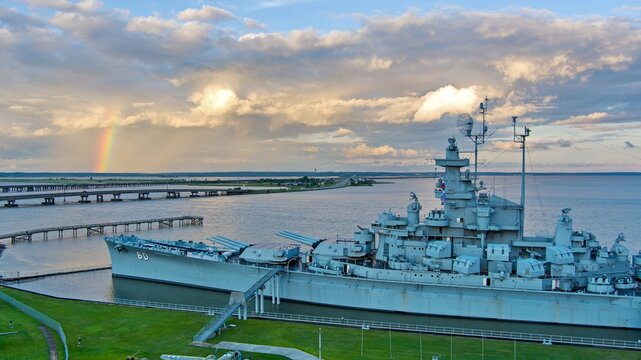 Rainbow after a storm over the battleship