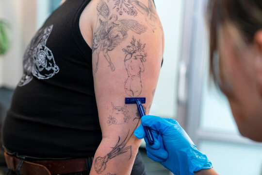 shaving arm tattoo