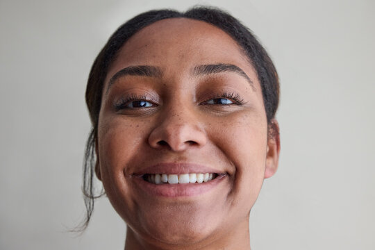 Young woman with no makeup in studio 
