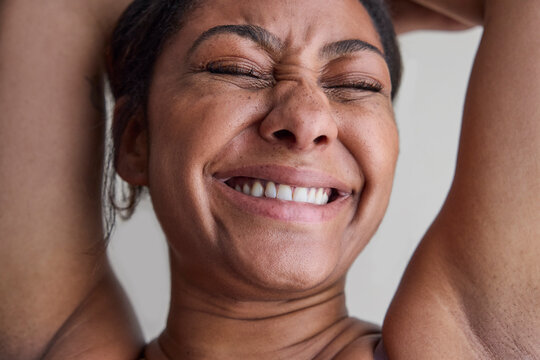 Young woman with no makeup in studio 