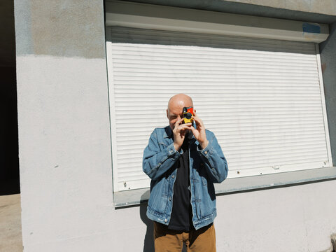 Person holding a disposable camera 