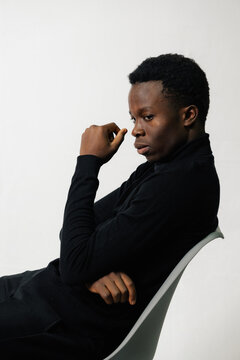 Man Posing in Black Turtleneck