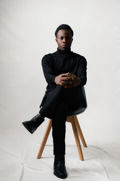 Man Posing in Black Turtleneck