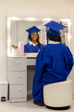 Teen graduation reflection look in mirror 