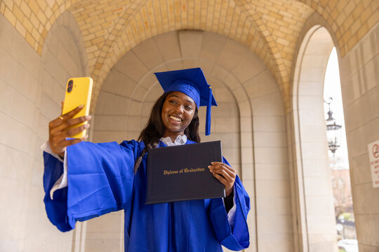 Black Teen high school graduate taking cellphone Selfie 