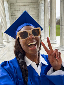 UGC Black Teen school graduate taking Selfie peace