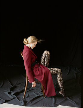 Elegant Pose With Striking Fashion in a Minimalist Setting