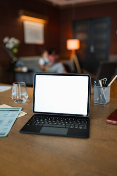 A laptop with white screen on the table