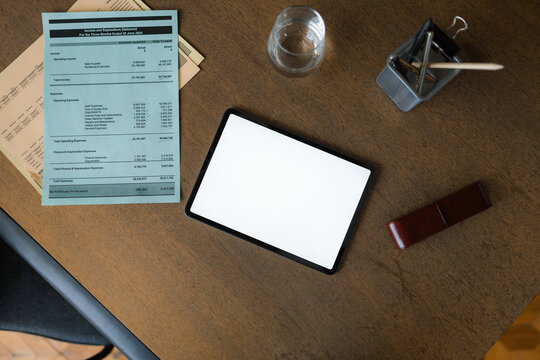 A tablet with white screen on the desktop