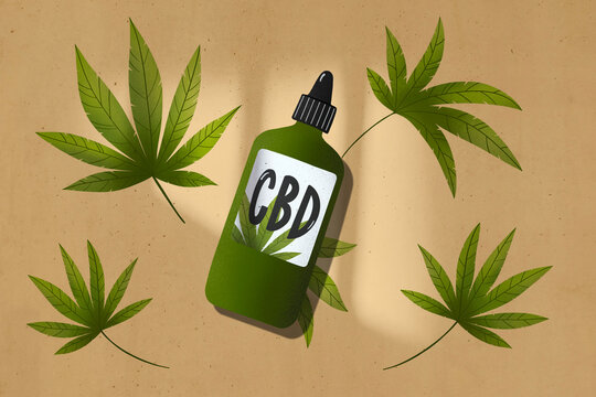 Green bottle of CBD with leaves of marijuana on beige background.