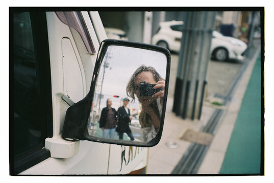 Street Reflection Through a Van Mirror