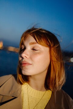 Portrait of a woman on the background of the sea