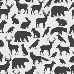 Obraz premium Seamless Pattern of Diverse Wildlife Silhouettes in Various Poses 1.