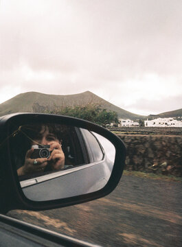 Film photography of selfie photos in a car mirror