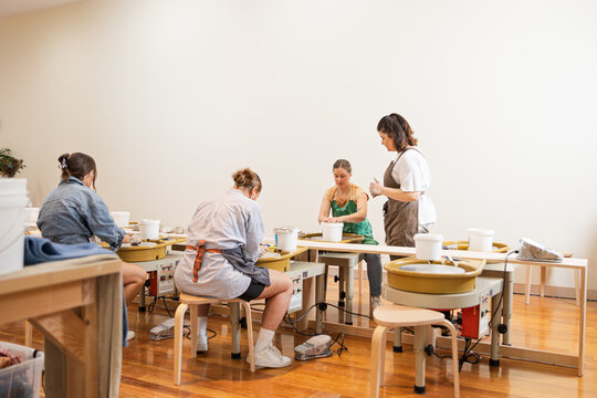 Group pottery class with students learning skills