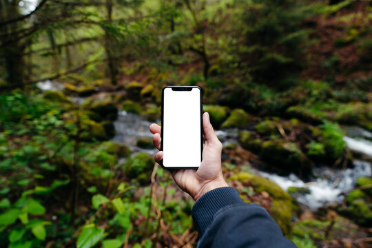Phone with white screen POV in nature