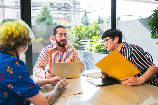 Latin American colleagues discussing startup business