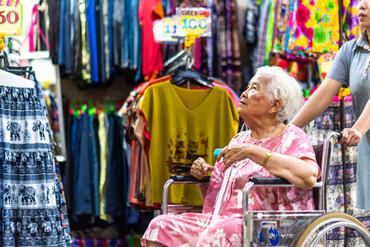 Elderly woman shopping in a Thai 
